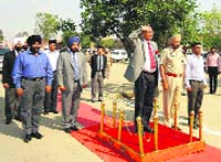 Justice Surya Kant of the Punjab and Haryana High Court taking the salute at a guard of honour during his visit to the sub-divisional courts complex at Guruharsahai on Thursday. A Tribune photograph