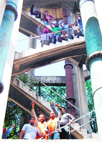 The protesting unemployed youths atop a water tank in Amritsar on Friday.