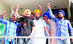 Youngsters protest against the ban on the film 'Sadda Haq' outside the booking counter of a cinema hall in Bathinda on Friday
