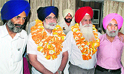 Sikander Singh Maluka (second from left) poses for a photograph after being unanimously elected president of the Punjab Kabaddi Association, in Bhatinda on Friday