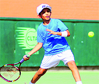 A player in action during a tennis match at the Tennis Academy, Sector 10, Chandigarh, on Friday