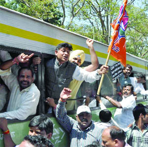 BJP workers court arrest during their protest outside the Chief Minister Sheila Dikshits residence in New Delhi on Friday. 