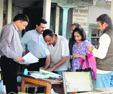 A vendor sells stamp papers in front of the tehsil office in Dharamsala. 