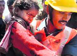 An injured child being taken away from the site.