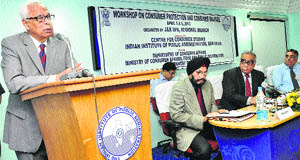 Governor NN Vohra addresses a workshop on consumer protection and welfare in Srinagar on Friday. 