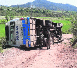 The bus which overturned in the Kaller area of Rajouri district on Friday. 
