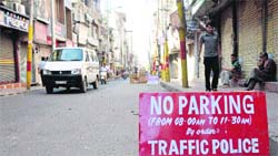 The traffic police today banned parking of two and four wheelers at the Raghunath Bazaar from 8 am to 11.30 am. Tribune photo: Anand Sharma