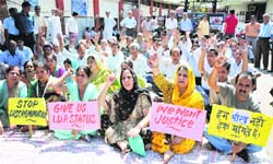 Members of Jagti Tenement Committee protest in Jammu on Friday. Tribune photo: Inderjeet Singh