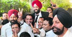 Supporters lift the newly elected president of the District Bar Association, Parupkar Singh Ghumman, in Ludhiana on Friday. Photo: Inderjeet verma