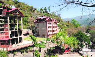 Serene no more Large scale construction activity continues in Solan area despite a dearth of buyers.