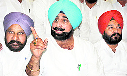 Senior Congress leader and MLA Jagmohan Kang (centre) interacts with media persons after addressing party workers in Bathinda on Saturday