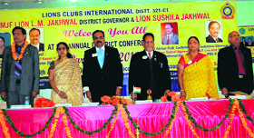 The chief guest and other members of the Lions Club sing the National Anthem during the 20th district annual conference in Mussoorie on Saturday.