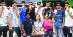 Medal winners of the Fencing Championship pose for a photograph. A Tribune Photo