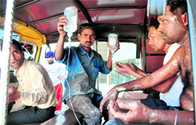 Injured workers on their way to the CMCH in an auto-rickshaw.