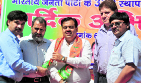BJP workers welcome Taran Chugh (centre), state secretary of the party, during a function in Ludhiana.
