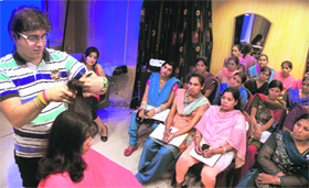 Girls from the Rural Self-Employment Training Institute get training at a salon in Ludhiana.