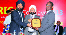 Ali illiassou, Ambassador, Embassy of the Republic of Niger, being presented with a memento during the Africa Conclave-2013 in Ludhiana.