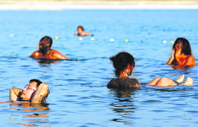 People float in the Dead Sea near the West Bank Jewish settlement of Mitzpe Shalem.