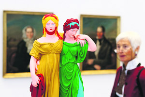 A woman looks at a sculpture by Hans-Peter Feldmann during a preview of his exhibition at the Deichtorhallen museum in Hamburg, Germany.