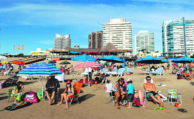 People sunbathe at the beach in Punta del Este.