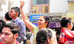 An anxious mother calls out for her son outside the school