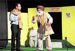 A scene from the play Mukti being staged at the open air theatre in Rose Garden on Sunday