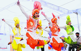 Students perform bhangra during the inaugural function of the new government smart school.