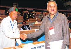 Uttarakhand Chief Minister Vijay Bahuguna meets Himachal Pradesh Chief Minister Virbhadra Singh at the Chief Ministers and Chief Justices of High Courts Conference in New Delhi on Sunday. 