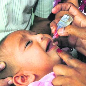 An infant being administered polio drops during a door-to-door campaign launched by the Health Department in Jalandhar on Sunday