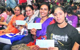 Sportspersons with their cheques at the Hansraj Stadium in Jalandhar