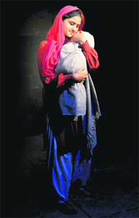 An artiste enacts a scene from the play, Dur aur Paas, staged at Natrang Studio Theatre in Jammu on Sunday. 