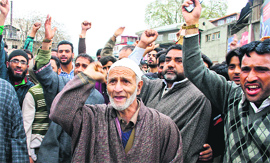 Family members and supporters of the victims protest outside Lal Ded Hospital in Sringar on Sunday.