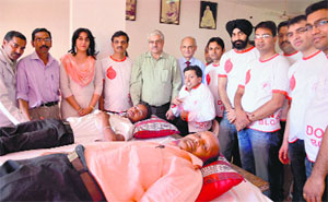 Volunteers donate blood at a blood donation camp organised at Shri Aadinatth Jain Mandir, Civil Lines.