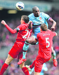 Liverpool's Lucas and Daniel Agger challenge West Ham United's Carlton Cole in their Premier League match on Sunday. The match ended in a 0-0 draw. 