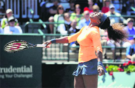 Serena Williams beats sister Venus in the semifinals of the Family Circle Cup. 