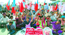 Activists of various youth organisations hold a protest on Bhandari Bridge.