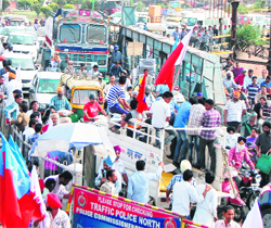 Commuters stuck in a massive traffic jam due to the protest in Amritsar on Monday.