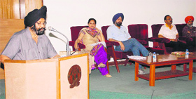 Registrar Dr Inderjit Singh addresses the workshop at the conference hall of Guru Nanak Bhawan of the Guru Nanak Dev University in Amritsar on Monday.