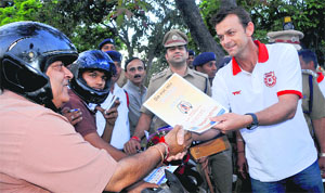 Safety first Adam Gilchrist, captain of Kings XI Punjab, makes motorists aware of the risk involved in drunk driving during a traffic awareness drive at Sector 35 in Chandigarh on Monday. 