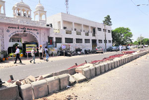 A view of the divider after the work was stopped on a 10 m open stretch on the bus stand-Balongi road at Phase V in Mohali 