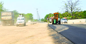 Work on the road dividing Phase-VIII, Mohali, and Sector 51, Chandigarh, nears completion. A view of the work in progress on Monday