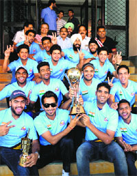 Cricket team of DAV College, Sector 10, Chandigarh, with the trophy on Monday.