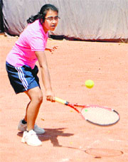 Tennis player Parul Gupta in action during a match at Gymkhana Club in Patiala