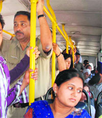 Constable Sanjay, who was injured after the rape accused fled from the police custody, leaves for his home on a CTU bus in Chandigarh on Monday
