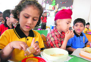 Students enjoy home-cooked food during a 'healthy tiffin' event at Shemrock School, Sector 69, in Mohali.