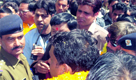 Supporters of candidates jostle with the police at the nomination centre in Mussoorie on Monday.