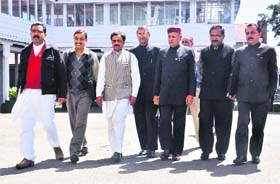 Former Chief Minister PK Dhumal and other BJP MLAs walk out from the Vidhan Sabha in Shimla on Monday