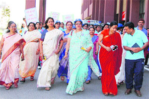Khanpur Kalan universitys Vice-Chancellor, Dr Pankaj Mittal (fourth from left) leads the "Mahila Atamraksha Jagrookta Rally on the university premises.