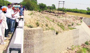 Deputy Commissioner Chander Shekhar along with other officials inspects works to prevent floods in Kaithal.