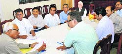 Governor NN Vohra with a delegation of Kashmiri Pandits at Raj Bhawan in Jammu on Monday. A Tribune photograph